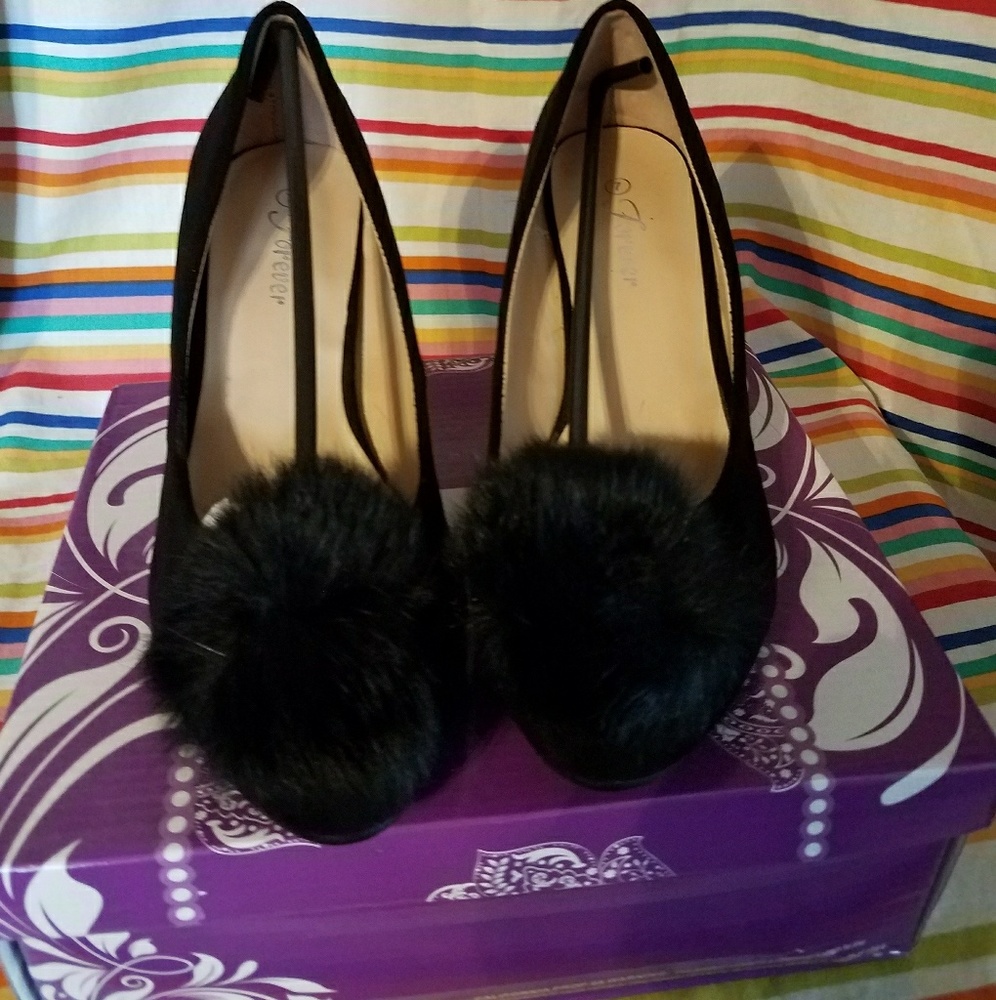 Black faux suede heels with marabou puff accent